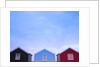 Beach huts in a row against sky by Assaf Frank